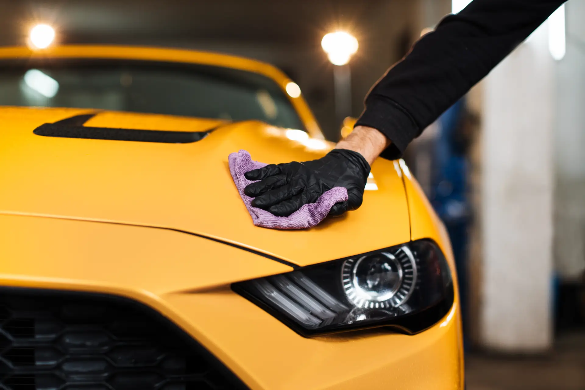 close-up-of-male-hand-in-black-rubber-glove-holdin-2024-12-13-08-44-38-utc