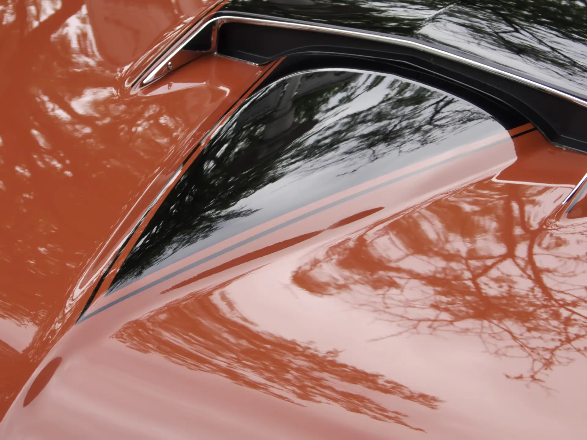 detail-of-hood-on-classic-red-car-2025-10-16-22-47-14-utc