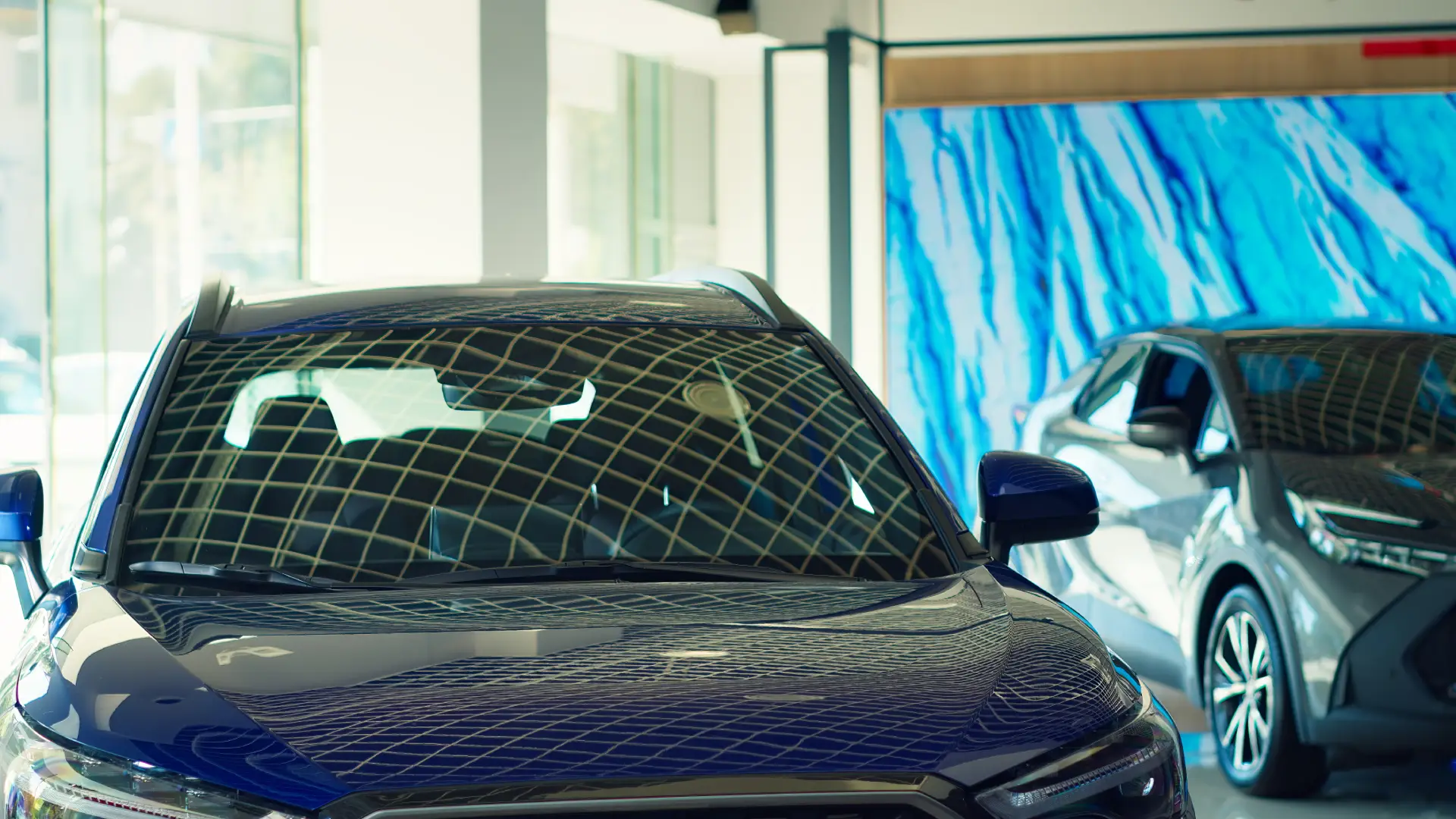 panning-shot-cars-with-sleek-design-showroom-waiting-be-purchased